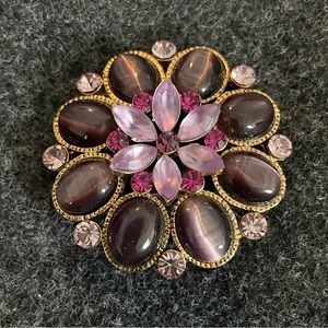 A pin with pretty deep purple stones